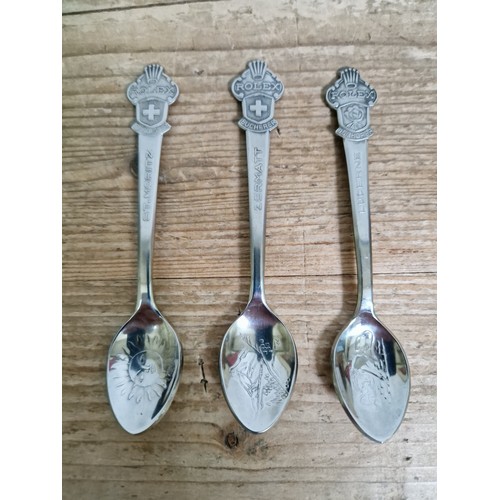 445 - A set of three Rolex spoons.