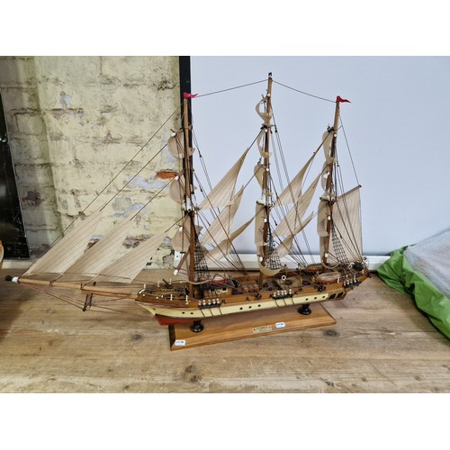 440 - A wooden model of a Clipper on stand.