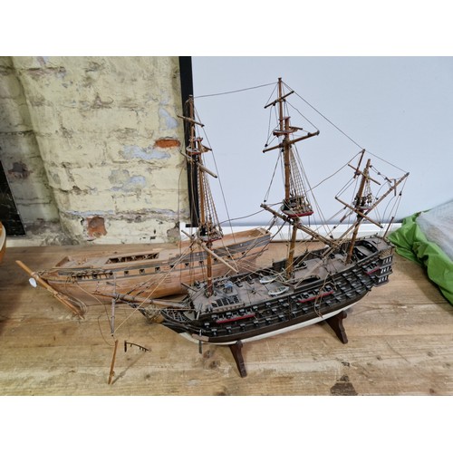 441 - Two wooden model boats; one with built in stand and one other as found.