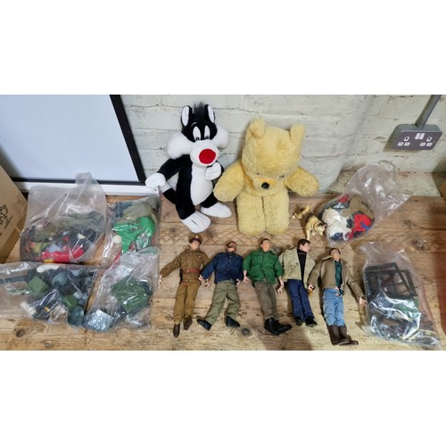 378 - A box of Action Man figures and accessories, together with two soft toys.