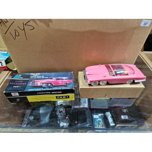 327 - A box of vintage toys including AJR 21 Thunderbird toys.