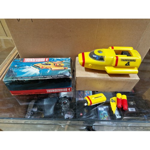 327 - A box of vintage toys including AJR 21 Thunderbird toys.