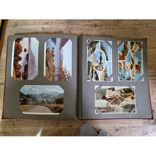 274 - Two albums of postcards, early 20th century, various subject matter, including Lake District etc., e... 