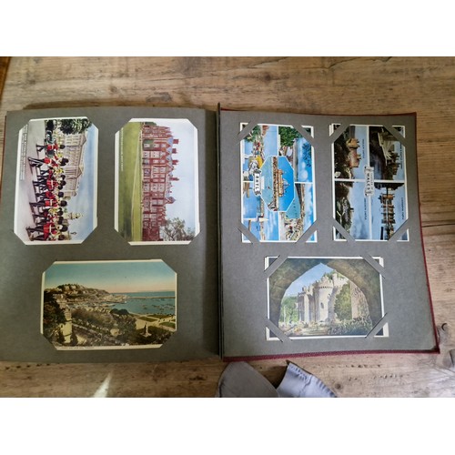 274 - Two albums of postcards, early 20th century, various subject matter, including Lake District etc., e... 