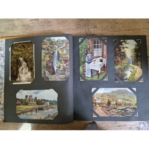 274 - Two albums of postcards, early 20th century, various subject matter, including Lake District etc., e... 