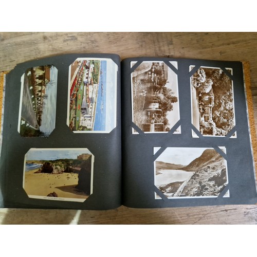 274 - Two albums of postcards, early 20th century, various subject matter, including Lake District etc., e... 