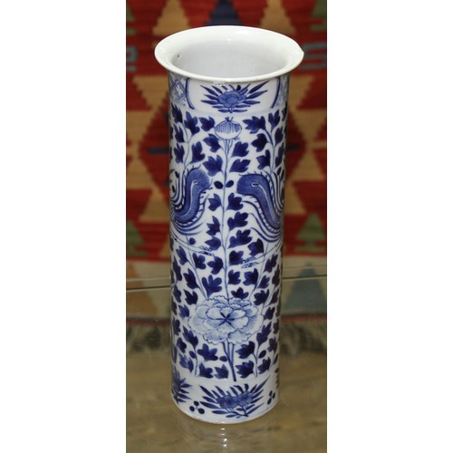 145 - A Chinese porcelain sleeve vase, decorated in underglaze blue with exotic birds and flowers, four ch... 