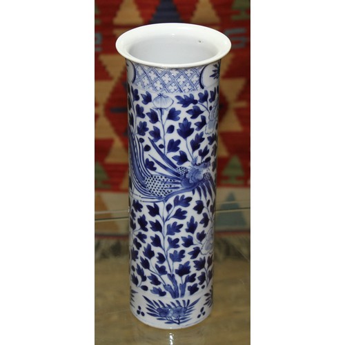 145 - A Chinese porcelain sleeve vase, decorated in underglaze blue with exotic birds and flowers, four ch... 