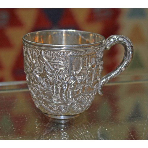 158 - A Chinese export silver teacup, decorated all over with a village scene, Wang Hing & Co, height 6.5c... 