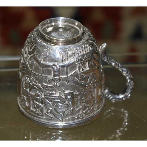 158 - A Chinese export silver teacup, decorated all over with a village scene, Wang Hing & Co, height 6.5c... 