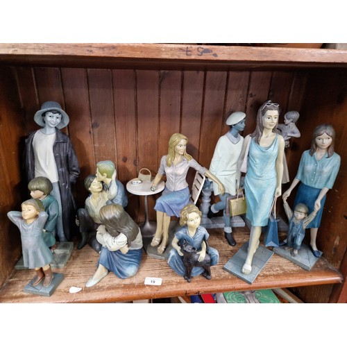 19 - A collection of Enesco Gallery Piazza figures in shades of blue
