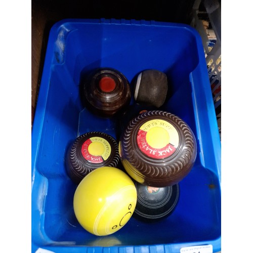 64 - A box containing two sets of crown green bowls