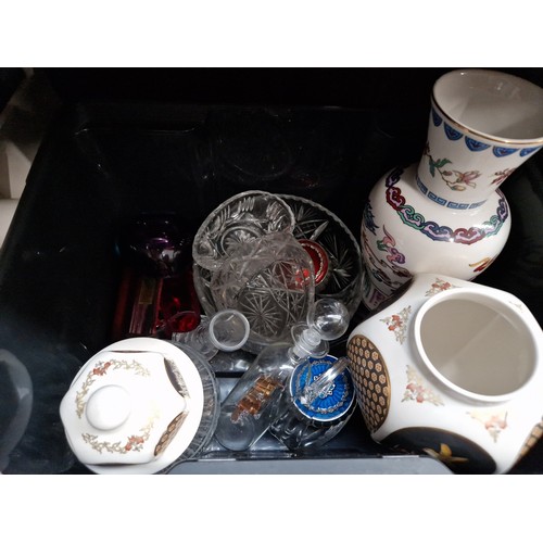 63 - A box containing three pottery vases together with glass bowls