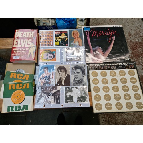 55 - Elvis Presley and Marilyn Monroe memorabilia including vinyl LP records, postcards and first edition... 