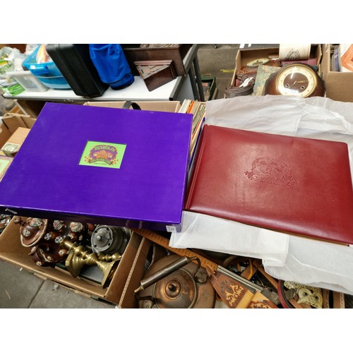 83 - A cased leather bound  photograph album