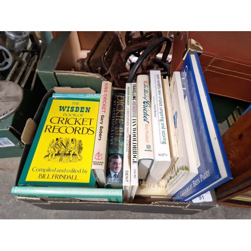 91 - A box of assorted books on cricket.