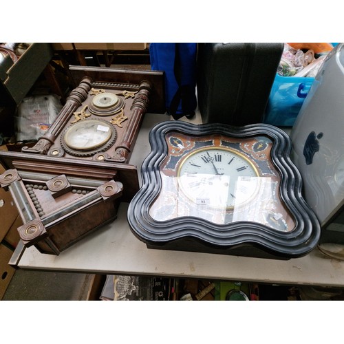 93 - A wall clock and a French (Caen) clock with case. inlaid with mother of pearl