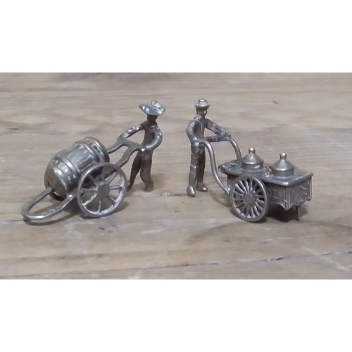 799C - A pair of Dutch silver miniature models.