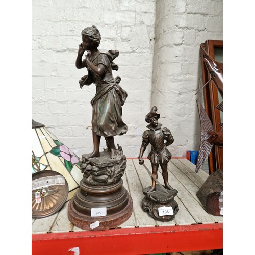 105 - Two spelter figures, one of a lady and the other of a French Cavalier