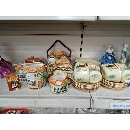 721 - A collection of Cottage ware including cups, saucers, tea plates, teapot, jugs, butter dish etc