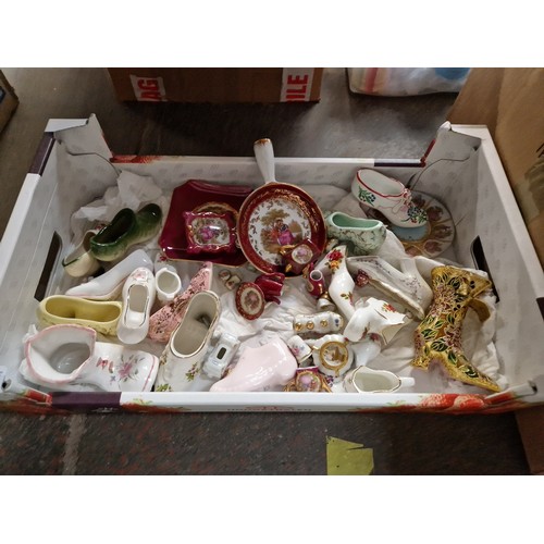 703 - A box of small china items including ceramic shoes and Limoges pottery