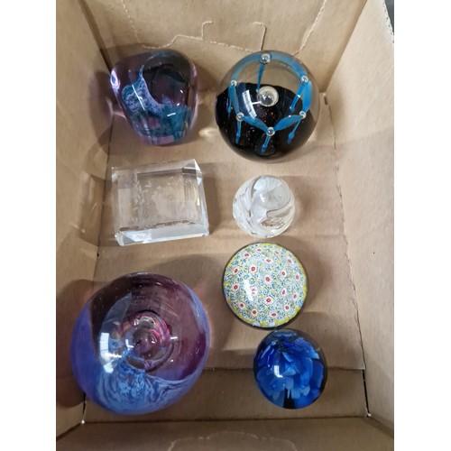 705 - Seven glass paperweights including Caithness glass, Isle of Wight,  and Murano.