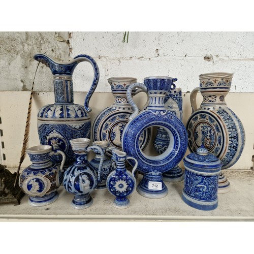 712 - Ten pieces of German salt glazed stoneware including large ewers and flasks.