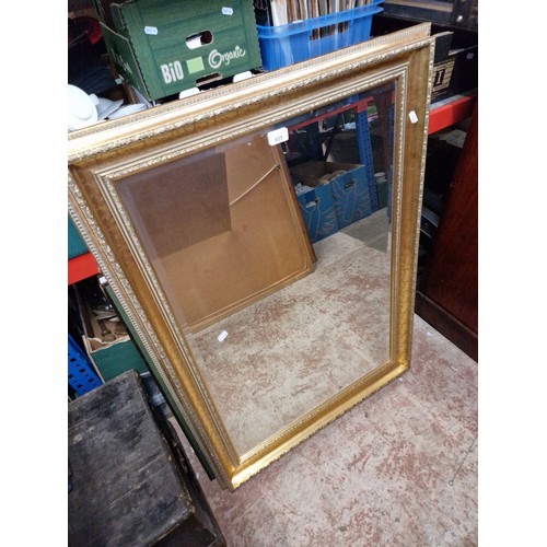 825 - A gilt framed mirror and two folding card tables.