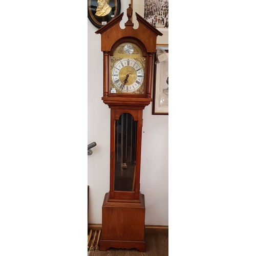 941 - A reproduction long case clock with brass dial, weights and pendulum.