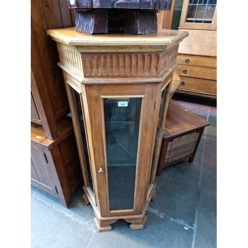 946 - An hexagonal glazed display cabinet.