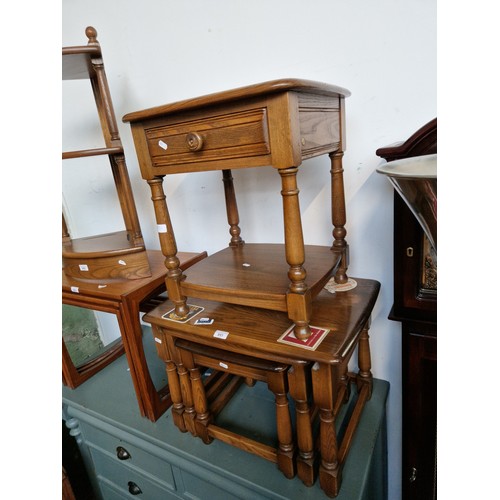 951 - An Ercol elm nest of tables together with an Ercol side table with drawer.