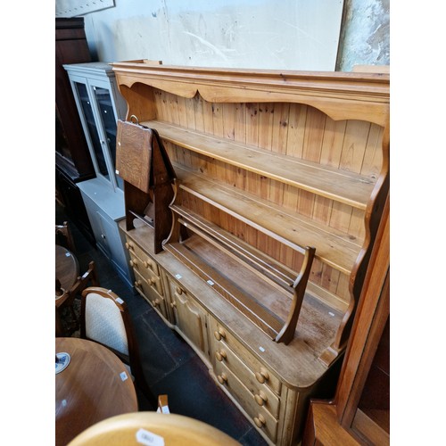 957 - A Victorian pine dresser with beech counter top and later plate rack back.