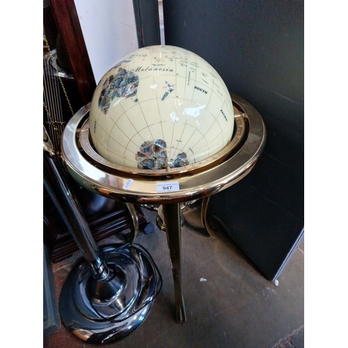 947 - A large terrestrial globe inlaid with semi precious stones.