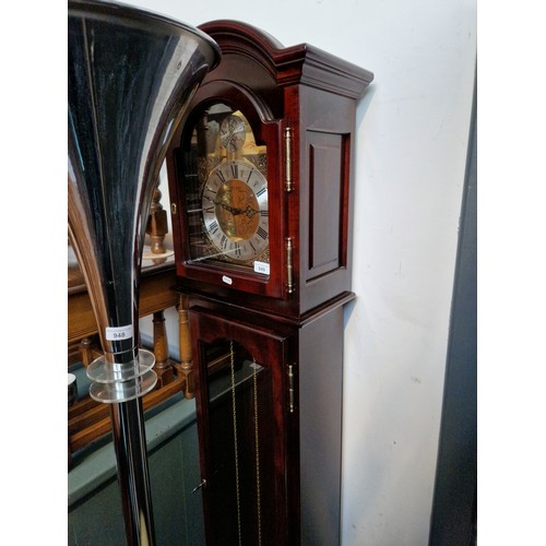 949 - A mahogany cased chiming grandmother clock with brass dial inscribed 'Tempus Fugit'.