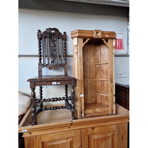 962 - A 19th century carved oak chair together with a pine corner cabinet.