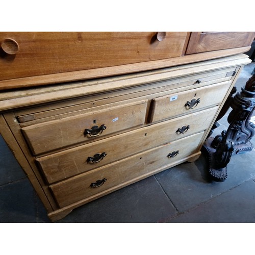 964 - An Edwardian pine chest of drawers with slide out brushing slide.