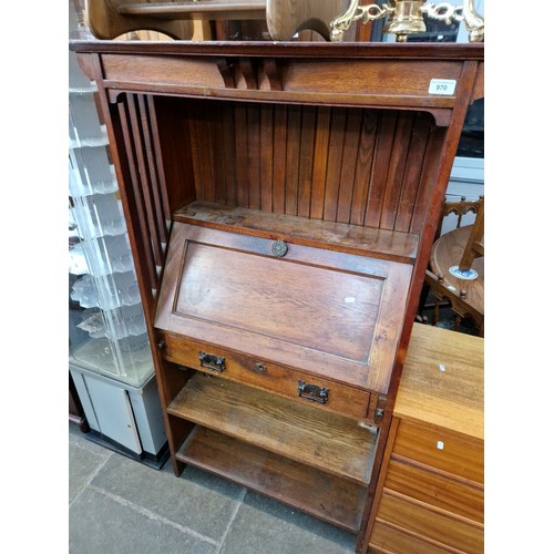 970 - An Edwardian Arts & Crafts oak bureau bookcase.