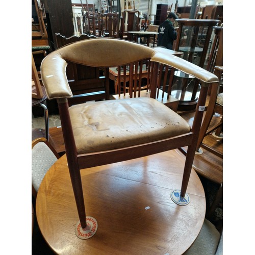 981 - A mid 20th century teak and leather armchair.