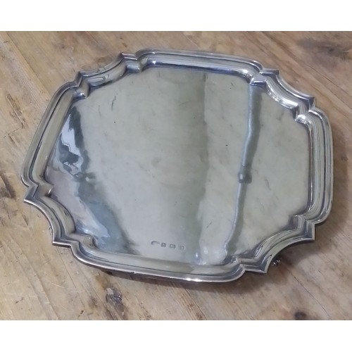 69 - A four footed silver salver, Alexander Clarke & Co Ltd, Birmingham 1913, width 30.5cm., wt. 27.6ozt.