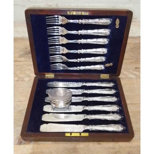 74 - A case set of 12 silver handled fish eaters and a hallmarked silver trinket box.