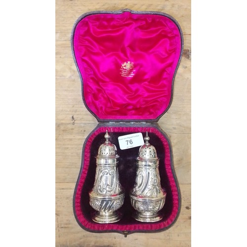 76 - A matched cased pair of Victorian silver pepper pots, Josiah Williams & Co, London 1889 & 1899 wt. 5... 