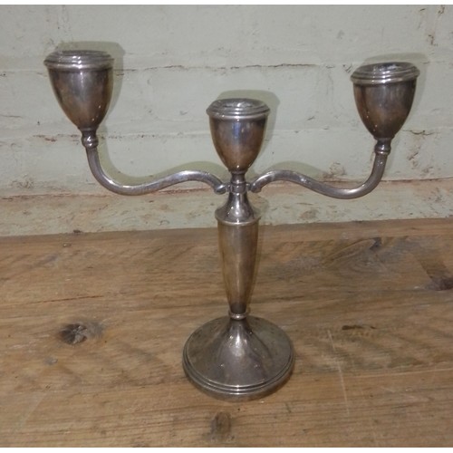 94 - A silver three branch candelabra, height 22cm.