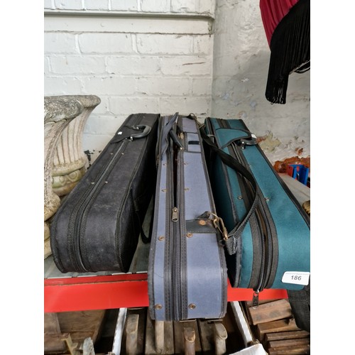 186 - Three cased student violins.