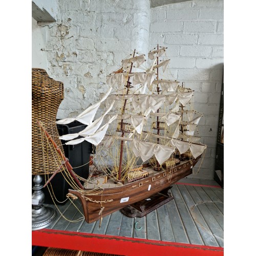 180 - Large model of Cutty Sark on plinth. Length appx 110cm