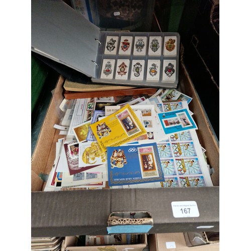 167 - A box of asorted stamps & a cigarette card album etc.