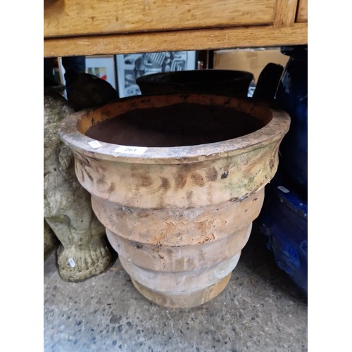 261 - A terracotta planter together with chimney pot cover