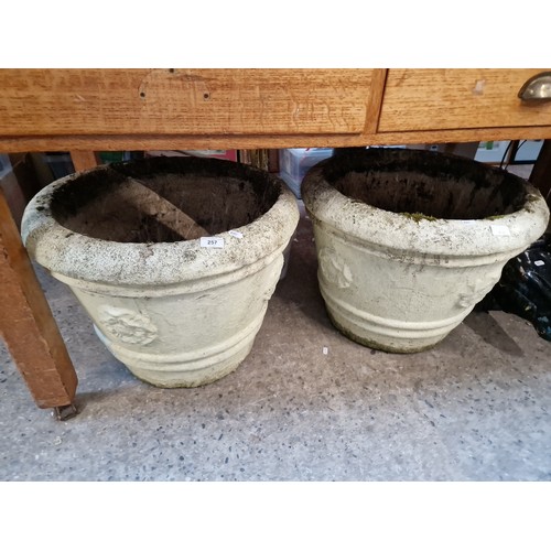 257 - 2 large circular concrete planters