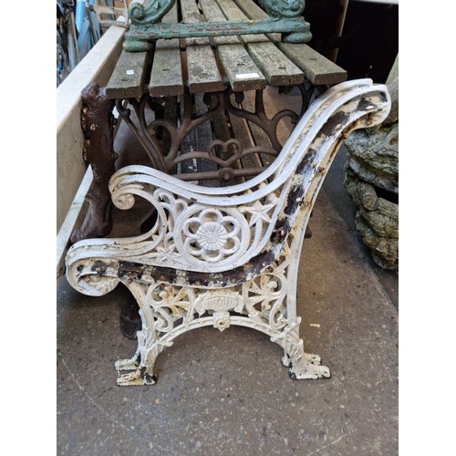 254 - A pair of cast metal garden bench ends.