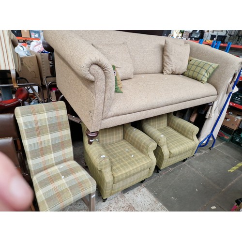 1091 - A tweed Chesterfield style sofa, two Next tweed wingback armchairs and a similar dining chair.