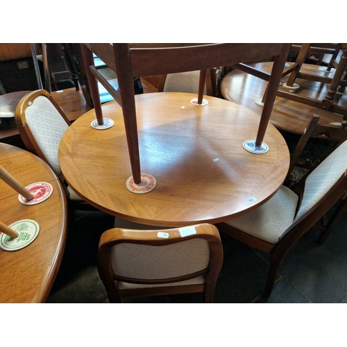 982 - A Nathan teak extending dining table and four chairs.